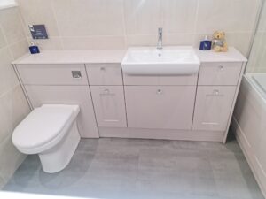 A functional restroom with a toilet and sink