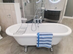 a white jacuzzi with a blue towel