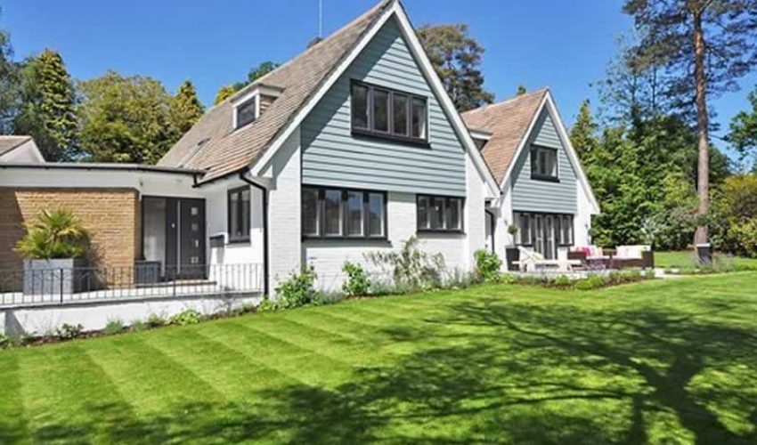 a beautiful home with a green lawn